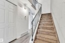 Stairs with wood finished floors and a high ceiling - 1281 Hooke Road, Edmonton, AB  - Indoor Photo Showing Other Room 