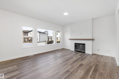 19428 25 Avenue, Edmonton, AB - Indoor Photo Showing Living Room With Fireplace