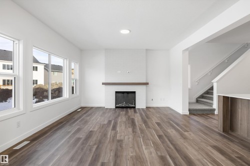 19428 25 Avenue, Edmonton, AB - Indoor Photo Showing Living Room With Fireplace