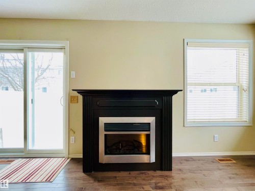 78 230 Edwards Drive, Edmonton, AB - Indoor Photo Showing Living Room With Fireplace