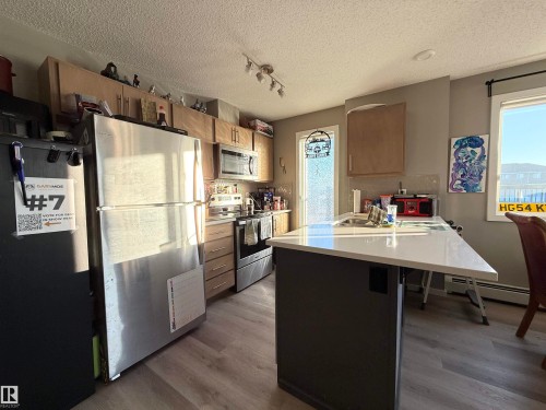 137 148 Ebbers Boulevard, Edmonton, AB - Indoor Photo Showing Kitchen With Stainless Steel Kitchen With Double Sink