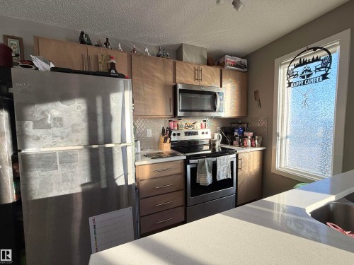 137 148 Ebbers Boulevard, Edmonton, AB - Indoor Photo Showing Kitchen With Stainless Steel Kitchen
