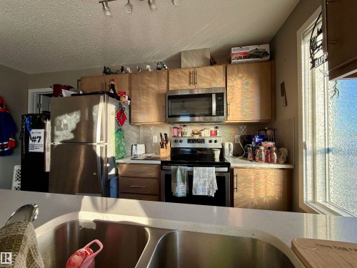 137 148 Ebbers Boulevard, Edmonton, AB - Indoor Photo Showing Kitchen With Stainless Steel Kitchen With Double Sink