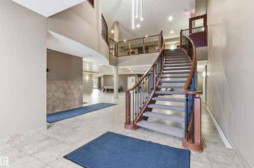 Stairway with recessed lighting and a high ceiling - 313 263 Macewan Road, Edmonton, AB - Indoor Photo Showing Other Room