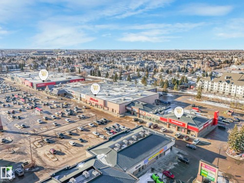 Aerial view of property and surrounding area with a commercial area - 61 9520 174 Street, Edmonton, AB - Outdoor With View