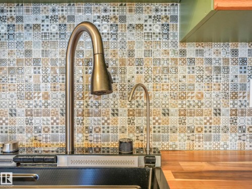 Kitchen view of wooden counters and ventilation hood - 61 9520 174 Street, Edmonton, AB - Indoor Photo Showing Other Room