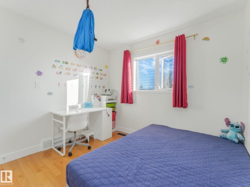 Bedroom with light wood-type flooring and baseboards - 61 9520 174 Street, Edmonton, AB - Indoor Photo Showing Bedroom