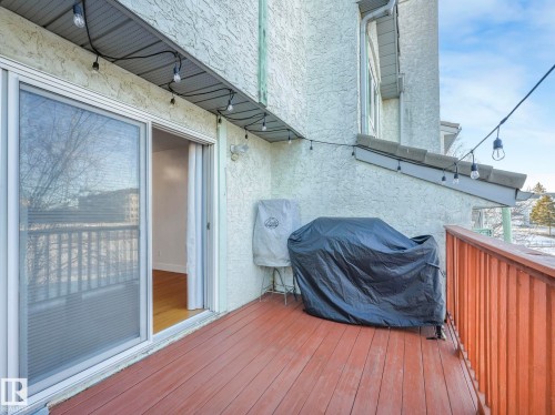 Wooden terrace with a grill - 61 9520 174 Street, Edmonton, AB - Outdoor With Exterior