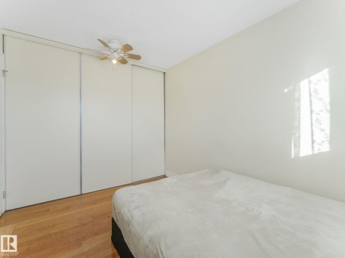Bedroom featuring light wood finished floors and a ceiling fan - 61 9520 174 Street, Edmonton, AB - Indoor Photo Showing Bedroom