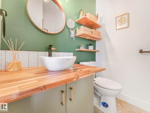 Half bath featuring toilet and vanity - 61 9520 174 Street, Edmonton, AB - Indoor Photo Showing Bathroom