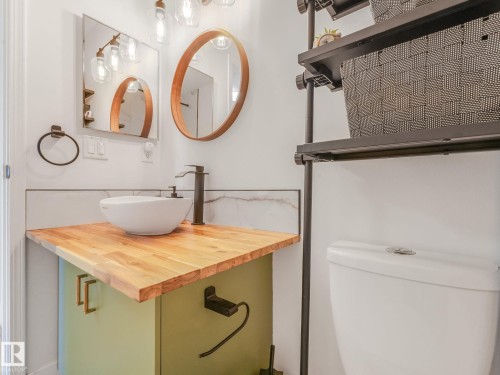 Half bathroom featuring vanity and toilet - 61 9520 174 Street, Edmonton, AB - Indoor Photo Showing Bathroom
