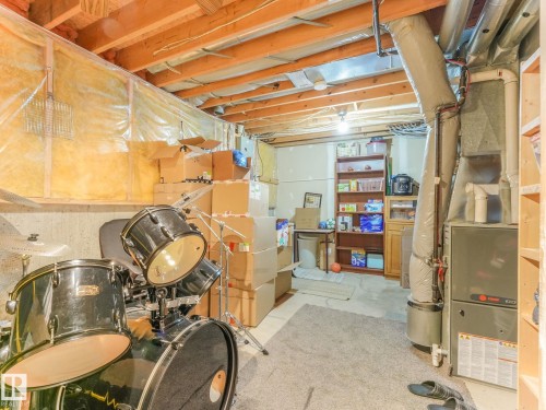 Unfinished below grade area featuring heating unit - 61 9520 174 Street, Edmonton, AB - Indoor Photo Showing Basement