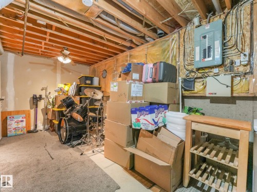 Storage room with electric panel and a ceiling fan - 61 9520 174 Street, Edmonton, AB - Indoor Photo Showing Basement
