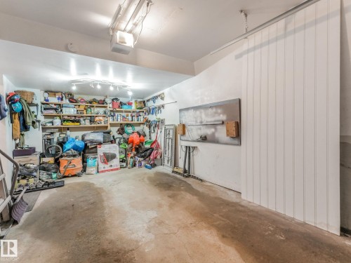 Garage featuring a garage door opener - 61 9520 174 Street, Edmonton, AB - Indoor Photo Showing Garage
