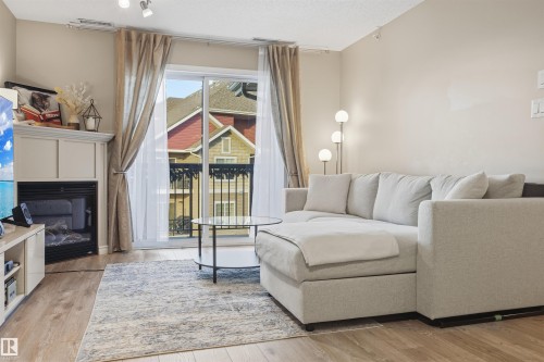 310 17407 99 Avenue, Edmonton, AB - Indoor Photo Showing Living Room With Fireplace