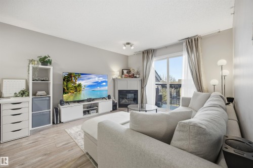 310 17407 99 Avenue, Edmonton, AB - Indoor Photo Showing Living Room With Fireplace