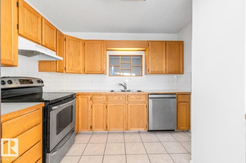 12411 53 Street, Edmonton, AB - Indoor Photo Showing Kitchen With Stainless Steel Kitchen With Double Sink