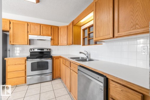 12411 53 Street, Edmonton, AB - Indoor Photo Showing Kitchen With Stainless Steel Kitchen With Double Sink