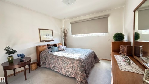 Bedroom featuring light colored carpet - 4608 102 Avenue, Edmonton, AB - Indoor Photo Showing Bedroom