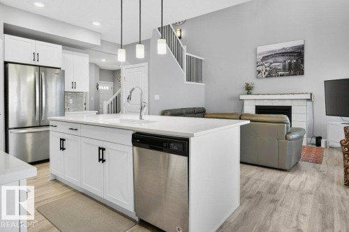 1909 Davidson Wynd, Edmonton, AB - Indoor Photo Showing Kitchen With Fireplace With Upgraded Kitchen