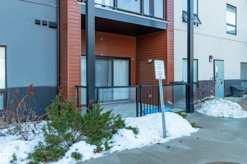 View of snow covered property entrance - 105 10006 83 Avenue, Edmonton, AB - Outdoor