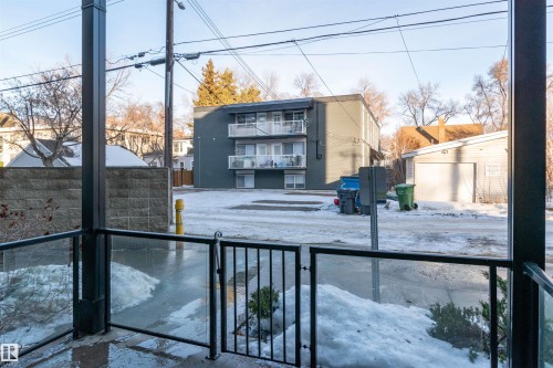 Snow covered house featuring stucco siding - 105 10006 83 Avenue, Edmonton, AB - Outdoor