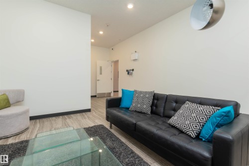 Lobby room with recessed lighting and light wood-style flooring - 105 10006 83 Avenue, Edmonton, AB - Indoor Photo Showing Living Room
