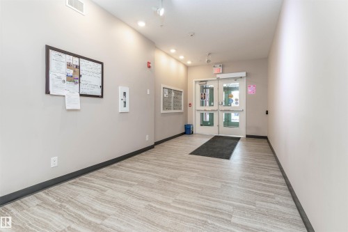 Building lobby featuring recessed lighting - 105 10006 83 Avenue, Edmonton, AB - Indoor Photo Showing Other Room