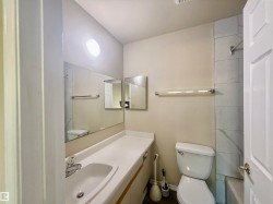 Bathroom featuring vanity and washtub / shower combination - 