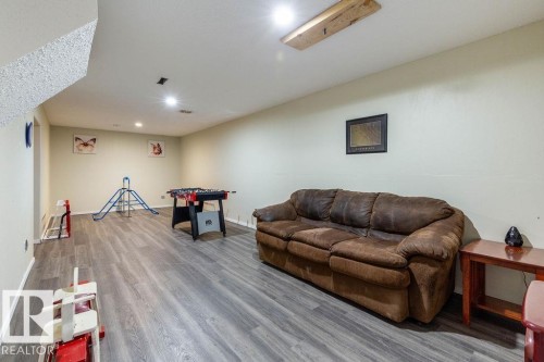 Living room with wood finished floors and recessed lighting - 4628 46 Ave, Evansburg, AB - Indoor