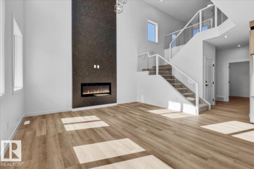 1119 Gyrfalcon Crescent, Edmonton, AB - Indoor Photo Showing Living Room With Fireplace