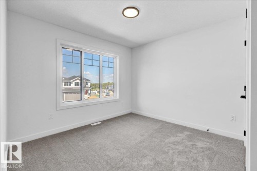 1119 Gyrfalcon Crescent, Edmonton, AB - Indoor Photo Showing Other Room