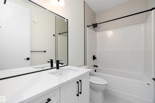 Full bathroom featuring vanity and shower / bathtub combination - Edmonton, AB - Indoor Photo Showing Bathroom