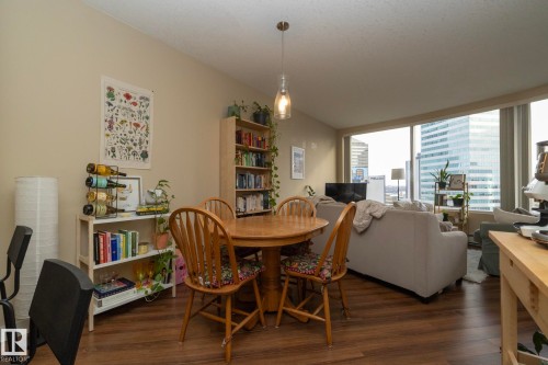 Dining room featuring dark wood-style floors - 1004 10136 104 Street, Edmonton, AB - Indoor