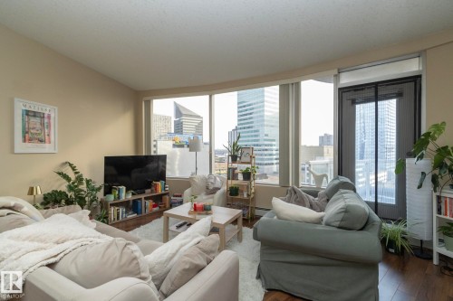 Living room featuring wood finished floors - 1004 10136 104 Street, Edmonton, AB - Indoor Photo Showing Living Room