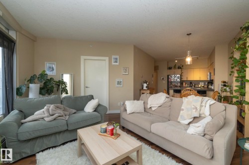 Living area featuring wood finished floors - 1004 10136 104 Street, Edmonton, AB - Indoor Photo Showing Living Room