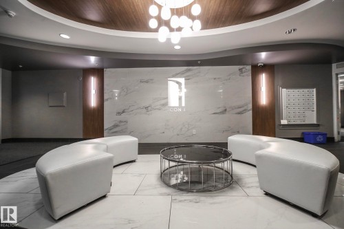 Living area with wood ceiling and hanging lights - 1004 10136 104 Street, Edmonton, AB - Indoor Photo Showing Other Room