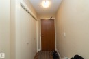 Doorway featuring a textured ceiling and wood finished floors - 1004 10136 104 Street, Edmonton, AB  - Indoor Photo Showing Other Room 