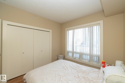 Bedroom featuring a closet and wood finished floors - 1004 10136 104 Street, Edmonton, AB - Indoor Photo Showing Bedroom