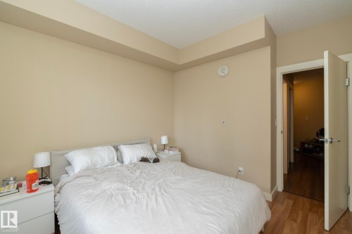 Bedroom featuring wood finished floors and baseboards - 1004 10136 104 Street, Edmonton, AB - Indoor Photo Showing Bedroom