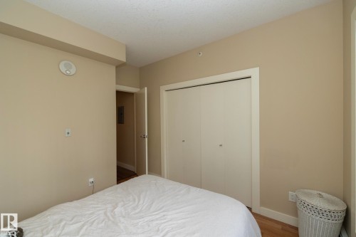 Bedroom with wood finished floors and a closet - 1004 10136 104 Street, Edmonton, AB - Indoor Photo Showing Bedroom