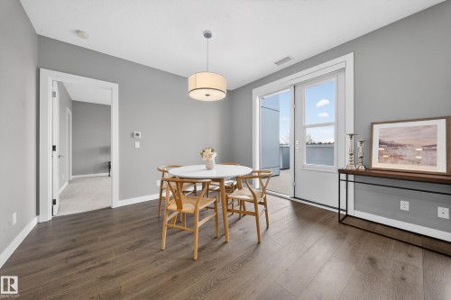 Dining room featuring dark wood finished floors - 416 61 Festival Way, Sherwood Park, AB - Indoor Photo Showing Dining Room