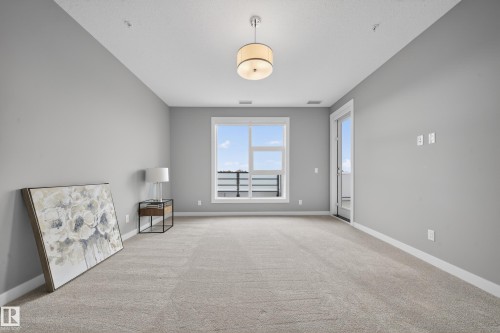 Unfurnished room featuring carpet floors and baseboards - 416 61 Festival Way, Sherwood Park, AB - Indoor Photo Showing Other Room