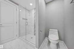 Bathroom featuring a stall shower and recessed lighting - 