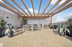 View of patio with outdoor dining space and grilling area - 