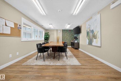 Dining area with light wood-style flooring and an accent wall - 416 61 Festival Way, Sherwood Park, AB - Indoor