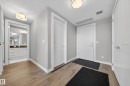 Entryway featuring light wood-style floors and a textured ceiling - 416 61 Festival Way, Sherwood Park, AB  - Indoor Photo Showing Other Room 