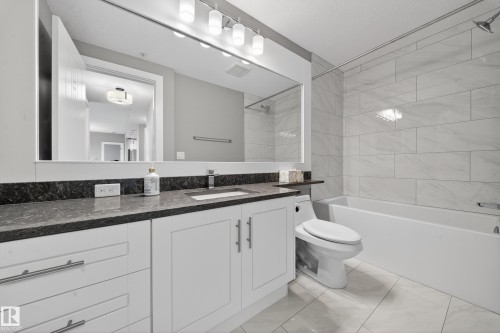 Bathroom with vanity and bathtub / shower combination - 416 61 Festival Way, Sherwood Park, AB - Indoor Photo Showing Bathroom