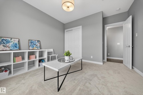 Office space featuring light colored carpet and baseboards - 416 61 Festival Way, Sherwood Park, AB - Indoor