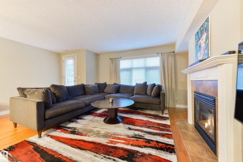 3 9026 Jasper Ave Avenue, Edmonton, AB - Indoor Photo Showing Living Room With Fireplace